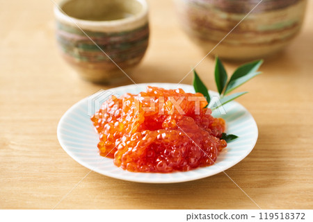 Herring roe marinated in soy sauce served on a small plate 119518372