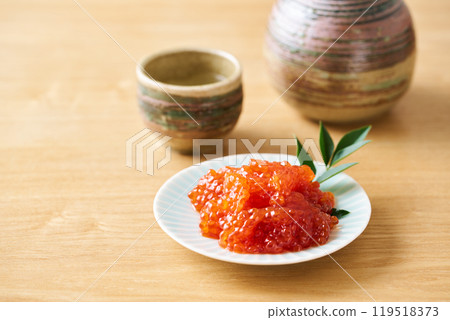 Herring roe marinated in soy sauce served on a small plate 119518373