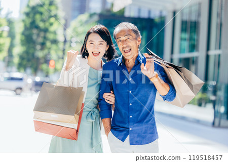 Senior couple enjoying shopping Senior couple enjoying shopping 119518457