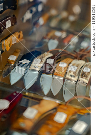 pocket knives on the store counter 119518595
