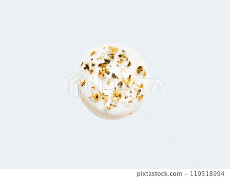 Minimalist white plate with yogurt topped with dried flower petals on a soft Minimalist white plate with yogurt topped with dried flower petals on a soft 119518994