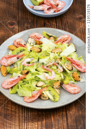 Seafood salad with shrimps and mussels on plate. Seafood salad with shrimps and mussels on plate. 119519376