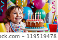 Child receiving birthday cake 119519478