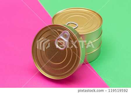 A Group of Stacked Tin Cans on Split Green and Cyan Background A Group of Stacked Tin Cans on Split Green and Cyan Background 119519592