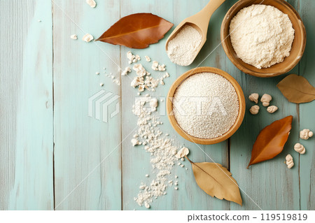 Bowl of flour and grains with bay leaves on a rustic wooden table in a cozy kitchen setting during 119519819