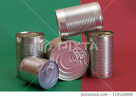A Group of Stacked Tin Cans on Split Red and Green Background A Group of Stacked Tin Cans on Split Red and Green Background 119520000