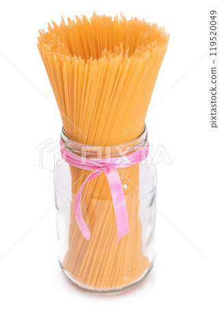 Dry Uncooked Spaghetti in a Glass Jar Isolated on White Background 119520049
