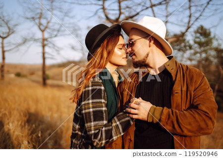 Lovely hipster couple resting in nature. People, lifestyle, relaxation and vacations concept. Lovely hipster couple resting in nature. People, lifestyle, relaxation and vacations concept. 119520946