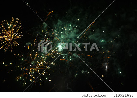 Bright spots of fireworks and colored smoke on a black background. Bright spots of fireworks and colored smoke on a black background. 119521683