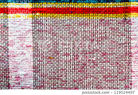Old handmade homespun doormat from strips of cloth Old handmade homespun doormat from strips of cloth 119524497