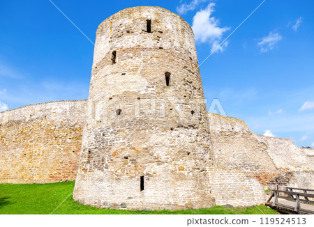 Ancient weathered rough stone walls and tower of the Izborsk fortress, Izborsk, Pskov region, Russia Ancient weathered rough stone walls and tower of the Izborsk fortress, Izborsk, Pskov region, Russia 119524513