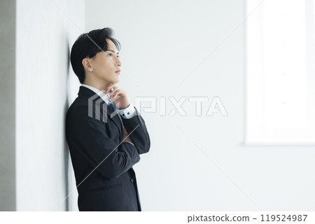 A thoughtful young businessman A thoughtful young businessman 119524987