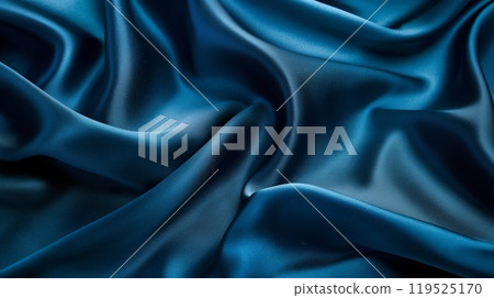 Elegant photo of a draped silk-textured background in a rich blue color 119525170