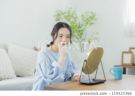 A young woman concerned about her skin condition 119525366