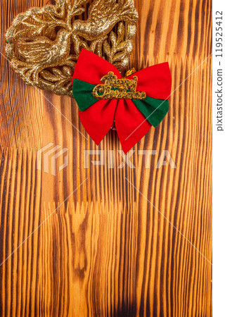golden heart decoration and merry christmas inscription 119525412