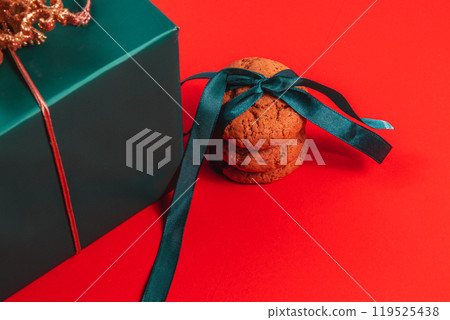 Green gift box with cookies with ribbon Green gift box with cookies with ribbon 119525438