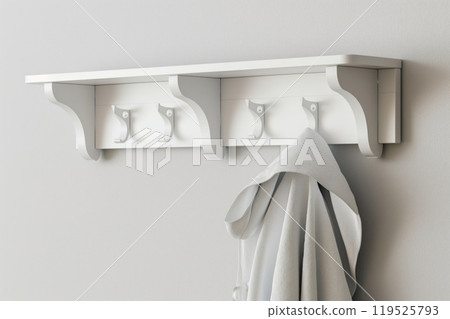 Sleek white coat rack with minimalist design hanging on a clean wall, featuring one coat 119525793