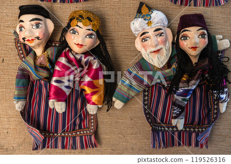 Handmade Uzbek hand puppets for sale are on the wall 119526316