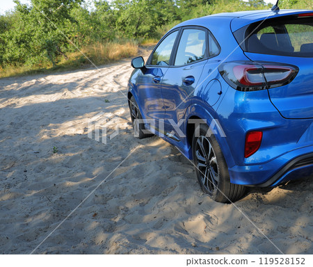 SUV Car Stuck In A Sand On A Outdoor Road Stock Photo SUV Car Stuck In A Sand On A Outdoor Road Stock Photo 119528152