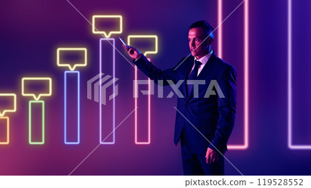 Young businessman, corporate presenter elaborates on data trends, using interactive visuals as support. Young businessman, corporate presenter elaborates on data trends, using interactive visuals as support. 119528552
