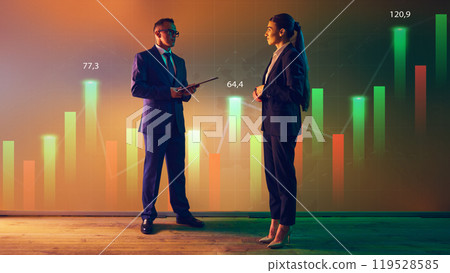 Professional explains his secretary, complex financial data with against vibrant, interactive visuals. 119528585
