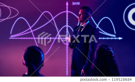 Photo of corporate presenter uses interactive graphs to engage audience in tech-driven meeting. Photo of corporate presenter uses interactive graphs to engage audience in tech-driven meeting. 119528684