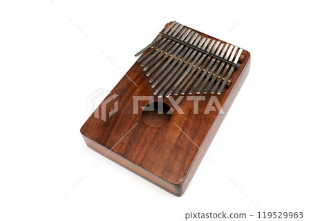 Kalimba or mbira is an African musical instrument. Kalimba made from wooden board with metal isolated on white background Kalimba or mbira is an African musical instrument. Kalimba made from wooden board with metal isolated on white background 119529963