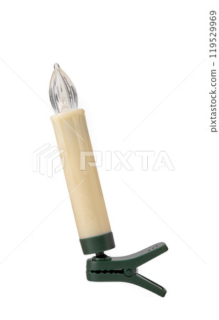 Vintage-style clip-on candle with a plastic flame, perfect for Christmas tree decoration or holiday displays isolated on white Vintage-style clip-on candle with a plastic flame, perfect for Christmas tree decoration or holiday displays isolated on white 119529969