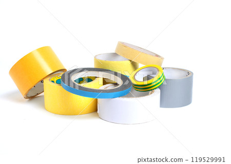 A heap of packing tape and a masking tape isolated on white background, with clipping path. adhesive tape. Scotch tape. A heap of packing tape and a masking tape isolated on white background, with clipping path. adhesive tape. Scotch tape. 119529991