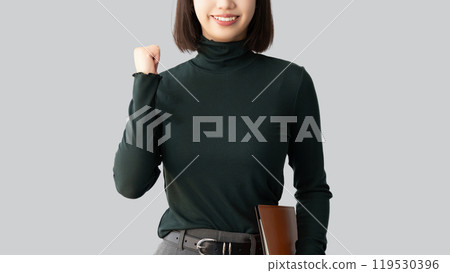 Young woman/businesswoman doing a fist pump Young woman/businesswoman doing a fist pump 119530396