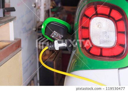 Renewable energy. Electric vehicle charger station installed in residential complex. Eco friendly transport. Renewable energy. Electric vehicle charger station installed in residential complex. Eco friendly transport. 119530477