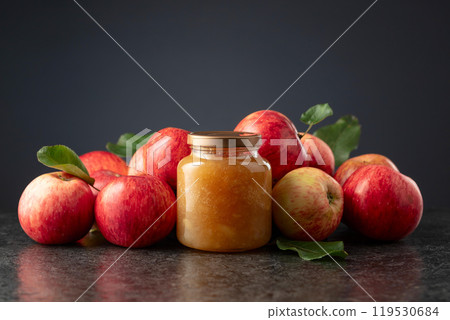 Apple jam and red fresh apples. 119530684