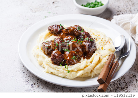 Beef meatballs in creamy sauce with mashed potatoes. Beef meatballs in creamy sauce with mashed potatoes. 119532139
