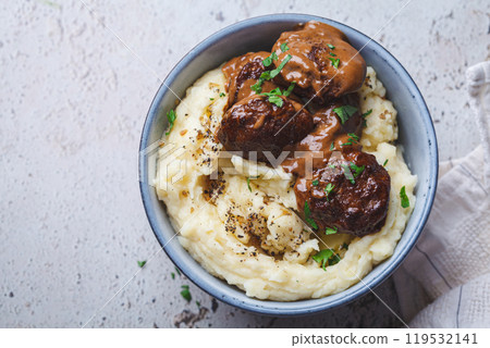 Beef meatballs in creamy sauce with mashed potatoes. Beef meatballs in creamy sauce with mashed potatoes. 119532141