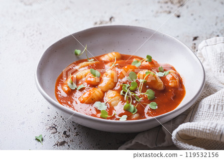 Tomato soup with gnocchi. 119532156