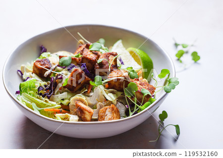Crispy tofu salad with cashews and sprouts. Crispy tofu salad with cashews and sprouts. 119532160