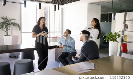 Happy multiethnic small business team meeting on co-working workspace Happy multiethnic small business team meeting on co-working workspace 119532530