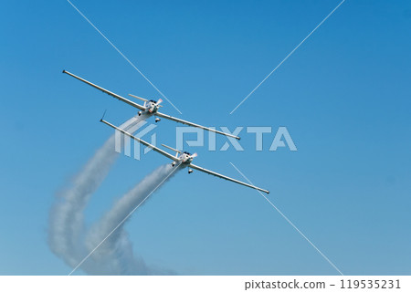 Stunt aerobatic plane performing stunts in air 119535231