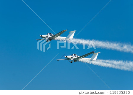 Stunt aerobatic plane performing stunts in air 119535250