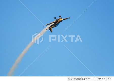 Stunt aerobatic plane performing stunts in air 119535268