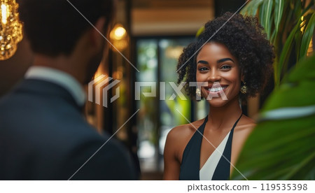 Luxury Hotel Manager Welcomes Young Black Woman To Hotel Room In Travel Setting With Ample Room For Copy. 119535398