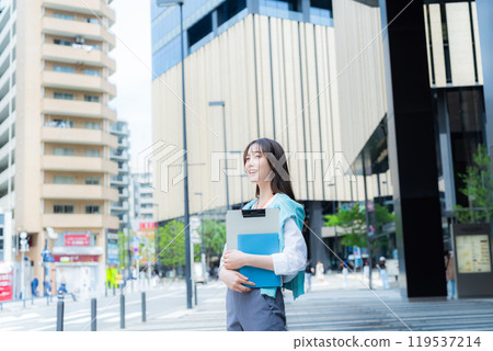 Business woman walking in the business district Business woman walking in the business district 119537214