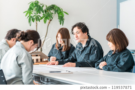 A male businessman in work clothes giving strict instructions at a meeting, conference, or business negotiation A male businessman in work clothes giving strict instructions at a meeting, conference, or business negotiation 119537871