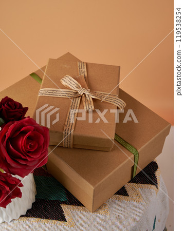 Simple style gift packaging and red rose handmade gift holiday gift brown paper box 119538254