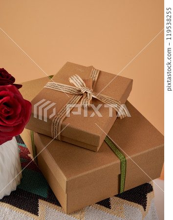 Simple style gift packaging and red rose handmade gift holiday gift brown paper box 119538255