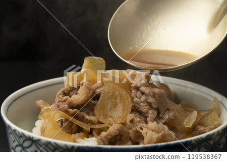 Gyudon: Place gyudon ingredients on rice Gyudon: Place gyudon ingredients on rice 119538367