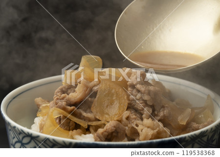 Gyudon: Place gyudon ingredients on rice Gyudon: Place gyudon ingredients on rice 119538368