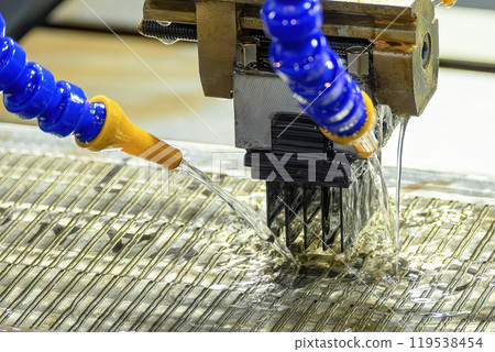 The graphite electrode working on EDM machine with liquid coolant method. The graphite electrode working on EDM machine with liquid coolant method. 119538454