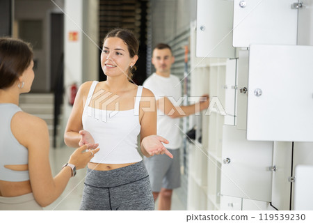 Young women exchanged couple of phrases in ladies locker room after changing clothes 119539230