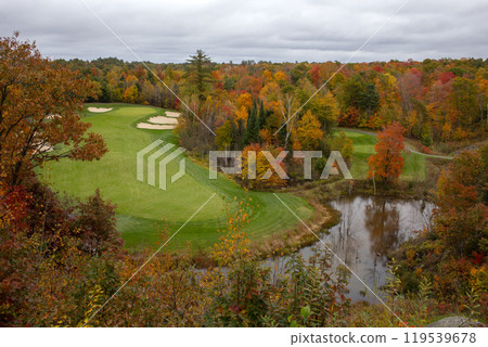 Aerial view of golf course with autumn trees and lake in Muskoka, Canada. Aerial view of golf course with autumn trees and lake in Muskoka, Canada. 119539678